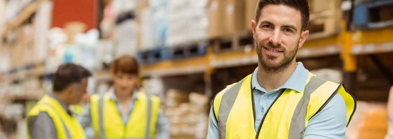 Supply chain Dent-O-Care warehouse worker smiling